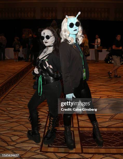 Elizabeth Meacham of Idaho, dressed as a Goth Cardassian character, and Isabelle Roberts of Idaho, dressed as a Punk Andorian character, attend the...