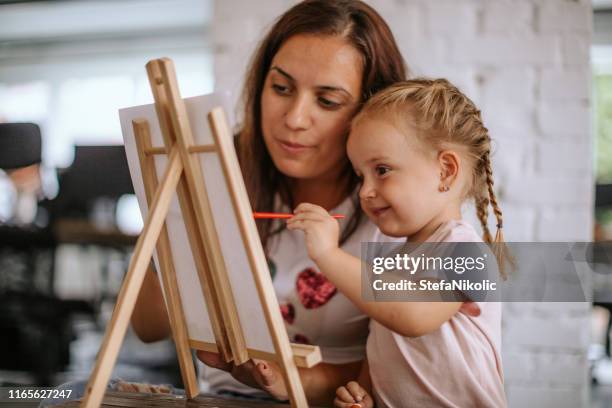 we are making our painting for wall - child painting stock pictures, royalty-free photos & images