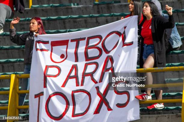 Independiente Santa Fe fans with a sign supporting the women's soccer league on 1st September 2019 in Bogota, Colombia.