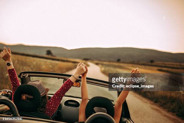 there is no end for our fun - girls driving a car stock pictures, royalty-free photos & images