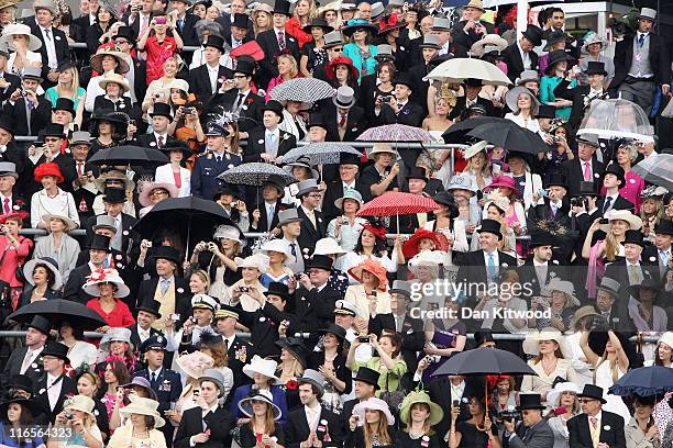 Racegoers pack the stands by the racecourse on Ladies Day at Royal Ascot on June 16, 2011 in Ascot, England. The five-day meeting is one of the...