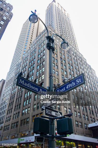 madison avenue and east 49th street signs in new york city - madison_avenue fotografías e imágenes de stock