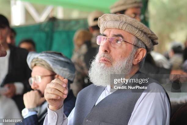 Gulbuddin Hekmatyar, the reconciled leader of Hizb-e-Islami, who also runs for president, talks with supporters during an election campaign in...