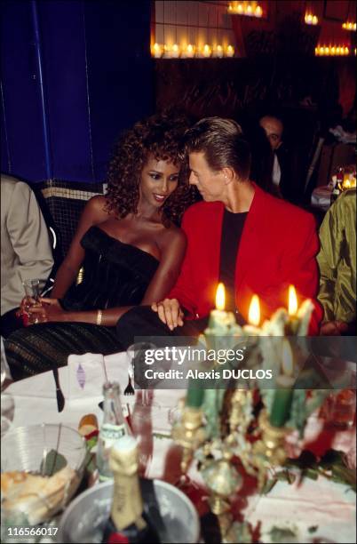 Iman and David Bowie at Les Bains douches during a soir?e dedicated to Francesca Dellera, on 18th September 1991 in Paris.