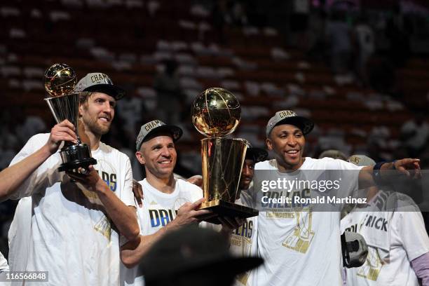 Finals MVP Dirk Nowitzki, Jason Kidd, Jason Terry and Shawn Marion of the Dallas Mavericks celebrate with the Larry O'Brien Championship trophy after...