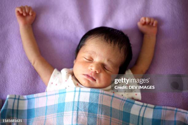 close up of newborn baby boy in deep sleep - indian baby boy stock pictures, royalty-free photos & images