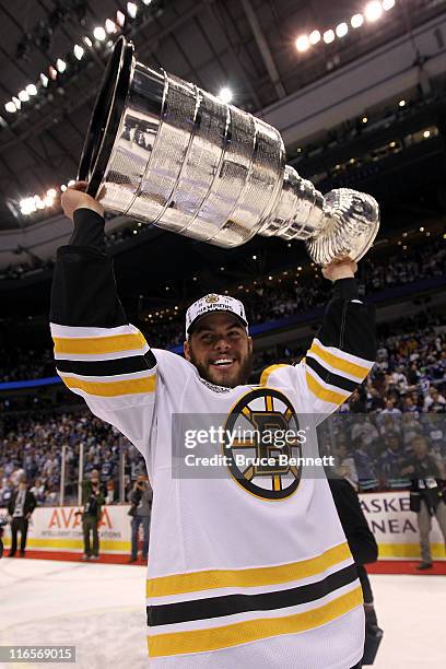 Nathan Horton of the Boston Bruins celebrates with the Stanley Cup after defeating the Vancouver Canucks in Game Seven of the 2011 NHL Stanley Cup...