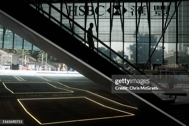 Man uses an escalator at the famous HSBC building on July 19, 2019 in Hong Kong, China. Hong Kong is one of the world’s leading and most established...