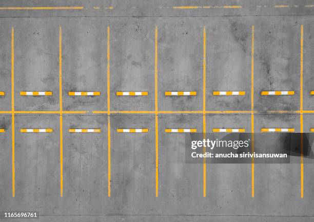 aerial top view car park road dividing line yellow without cars. - car park barrier stock-fotos und bilder