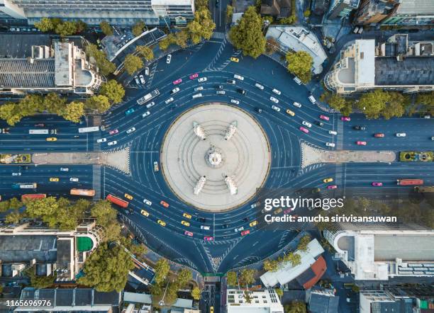 aerial top view of road intersection complex roundabout at day. - green bridge over trees stock pictures, royalty-free photos & images