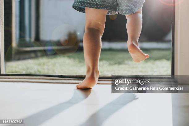 little legs - walking indoors stock pictures, royalty-free photos & images