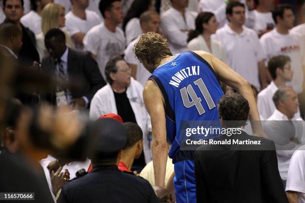 Dirk Nowitzki of the Dallas Mavericks immediately leaves the court as the final buzzer sounds and the Mavericks win 105-95 against the Miami Heat in...