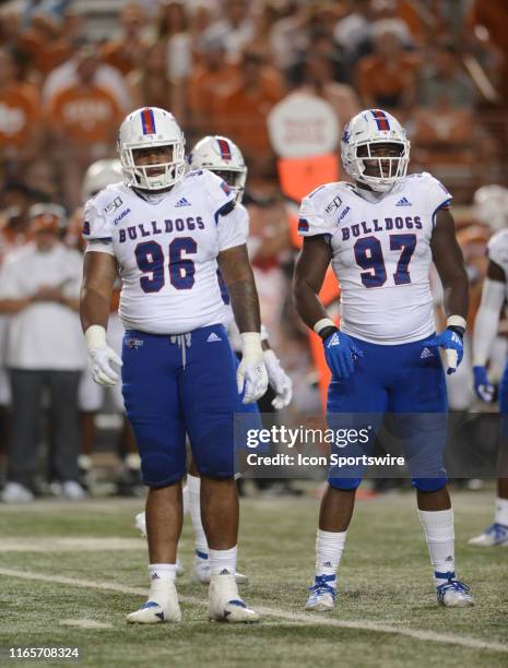 Louisiana Tech Bulldogs linemen Ka'Derrion Mason and Milton Williams get signals from the sideline during game against the Texas Longhorns on August...
