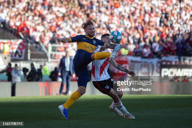 Alexis Mac Allister of Boca Juniors in action with Gonzalo Montiel of River Plate during the Superliga 2019/2020 match between River Plate and Boca...