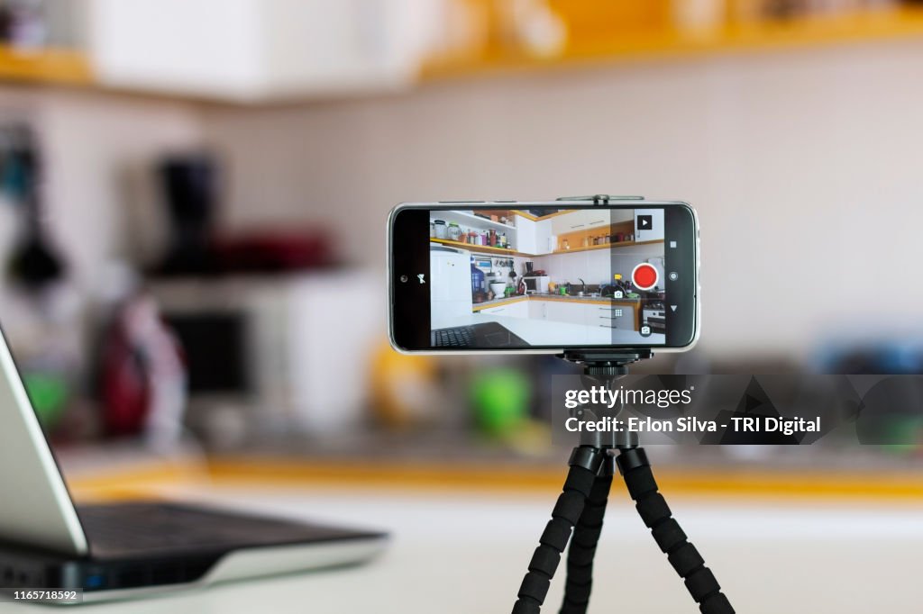 Smartphone ready for vlogging in the kitchen
