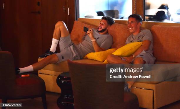 Adam Lallana and Harry Wilson of Liverpool watching a game of table tennis on August 02, 2019 in Evian-les-Bains, France.