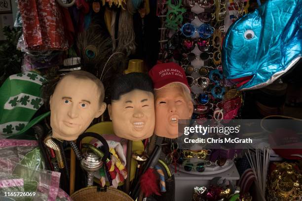 Face masks of Russian President Vladimir Putin, Supreme leader of North Korea, Kim Jong-Un and U.S. President Donald Trump are seen for sale at a...