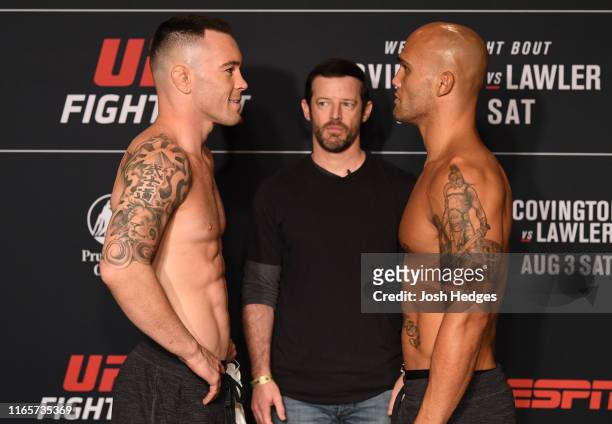 Opponents Colby Covington and Robbie Lawler face off during the UFC Fight Night official weigh-in at the DoubleTree Hotel on August 02, 2019 in...