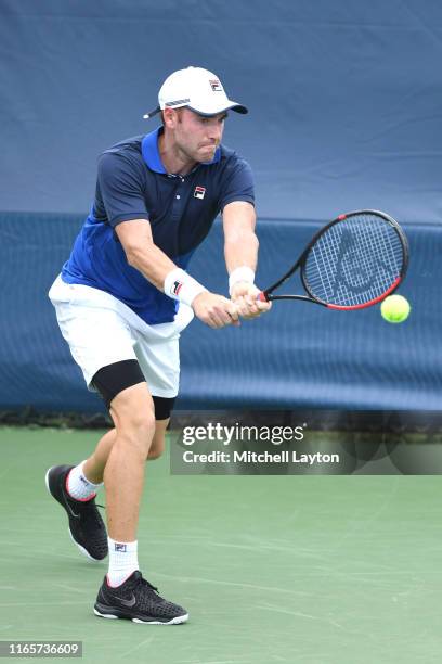 Bjorn Fratangelo of the United States returns a shot from Daniil Medvedev of Russia during Day 2 of the Citi Open at Rock Creek Tennis Center on July...