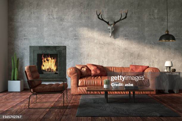 loft interior mit ledersofa und fireplace - jagdhorn stock-fotos und bilder