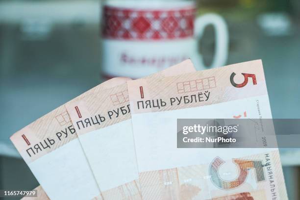 This photo illustration show The Belarusian ruble or rouble , the official currency of Belarus banknotes are seen in Grodno, Belarus on 1 September...