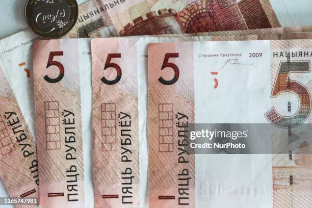 This photo illustration show The Belarusian ruble or rouble , the official currency of Belarus banknotes and coins are seen in Grodno, Belarus on 1...