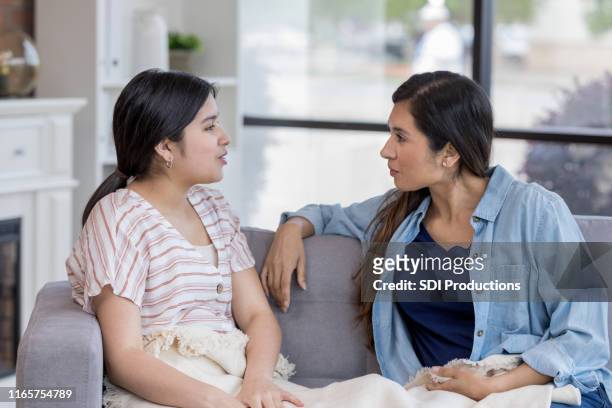 teen is defensive when mom questions her - aunt niece stock pictures, royalty-free photos & images