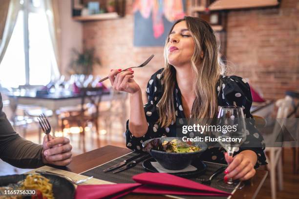 this is delicious! - chewing food stock pictures, royalty-free photos & images
