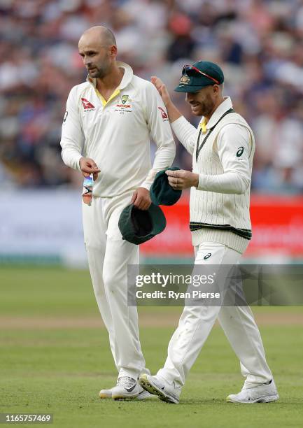 Nathan Lyon and David Warner of Australia look on during day two of the 1st Specsavers Ashes Test between England and Australia at Edgbaston at...