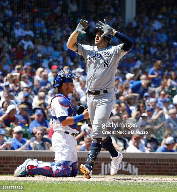 Ryan Braun of the Milwaukee Brewers celebrates his solo home run during the second inning of a game against the Chicago Cubs at Wrigley Field on...