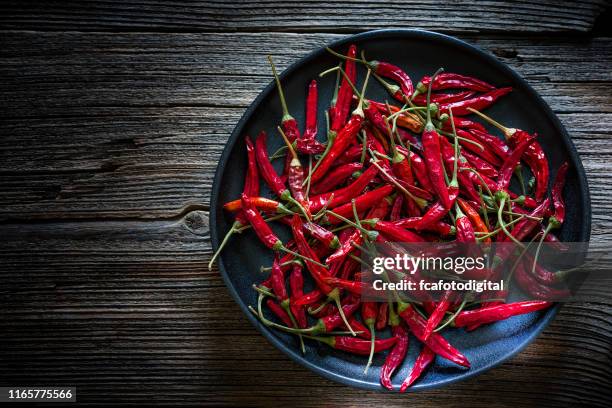 dried red chili peppers shot from above - habanero stock pictures, royalty-free photos & images