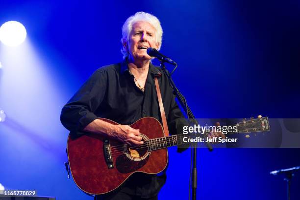 Graham Nash performs on stage during the Cambridge Folk Festival 2019 at Cherry Hinton Hall on August 02, 2019 in Cambridge, England.