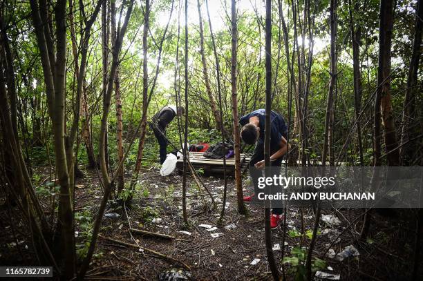 Drug addict Michael is seen preparing to inject cocaine in a small wooded area used by addicts to take drugs near Glasgow city centre, Scotland, on...