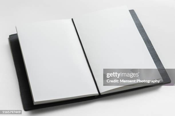 open book with blank pages on gray background - magazine spread stock pictures, royalty-free photos & images