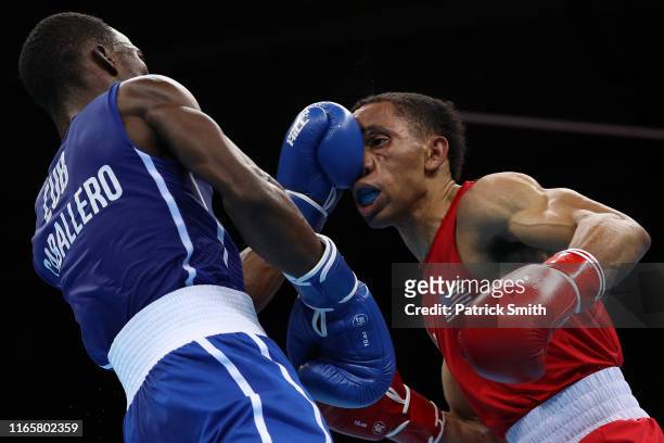 Osvel Caballero of Cuba exchanges punches with Duke Ragan of United States during Men's Bantam Final Bout on Day 7 of Lima 2019 Pan American Games at...
