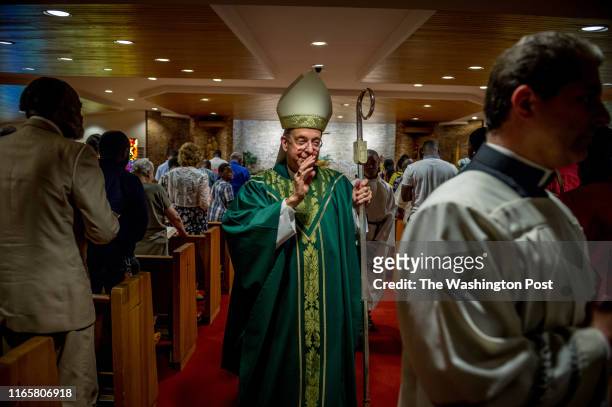 Archbishop William Lori, head of the Archdiocese of Baltimore, leaves after delivering Sunday Mass at Holy Family Catholic Church on July 14, 2019 in...