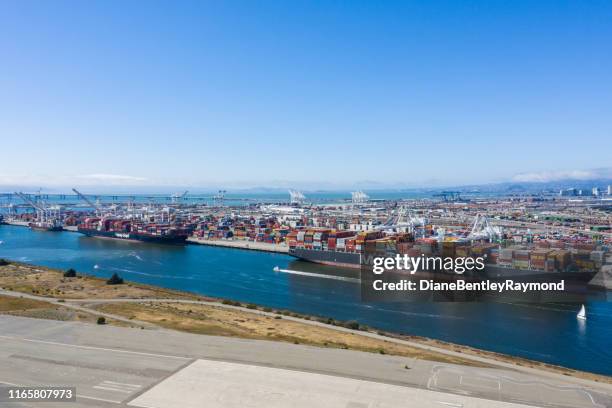 aerial view of oakland container ships - alameda california stock pictures, royalty-free photos & images