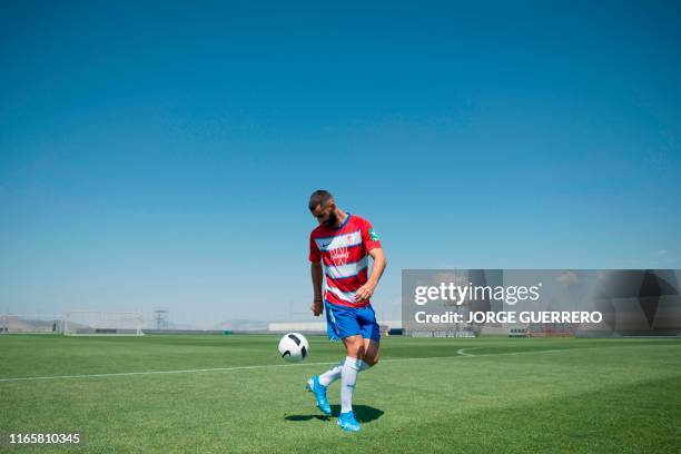 Granada's new player French midfielder Maxime Gonalons poses during his official presentation at Granada CF Sport City in Granada on September 3,...