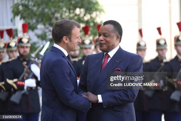 French President Emmanuel Macron welcomes Republic of the Congo's President Denis Sassou Nguesso at the Elysee Palace in Paris on September 3, 2019.