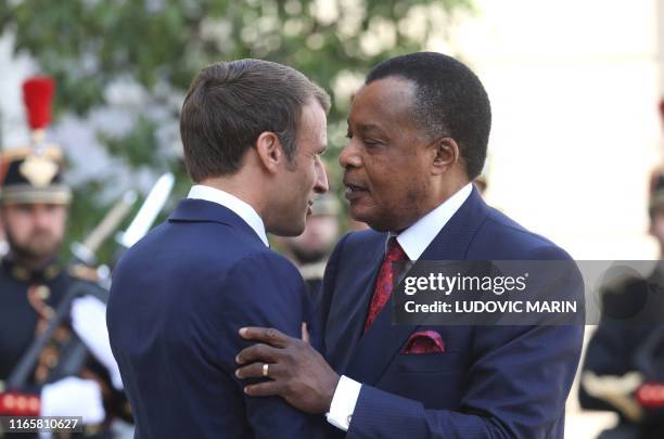 French President Emmanuel Macron welcomes Republic of the Congo's President Denis Sassou Nguesso at the Elysee Palace in Paris on September 3, 2019.