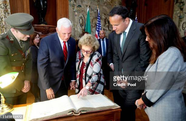 Vice President Mike Pence, Mrs Nancy Pence-Fritsch, Leo Varadkar, An Taoiseach and Second Lady Karen Pence are shown the service records of Pence's...