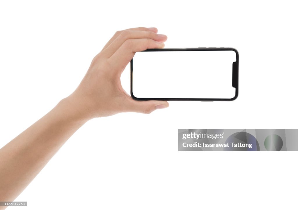 Close up hand hold phone isolated on white, mock-up smartphone white color blank screen