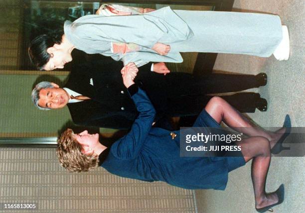 File photo dated February 1995 shows Diana , Princess of Wales meeting with Japanese Empress Michiko while Emperor Akihito looks on. Diana died in a...