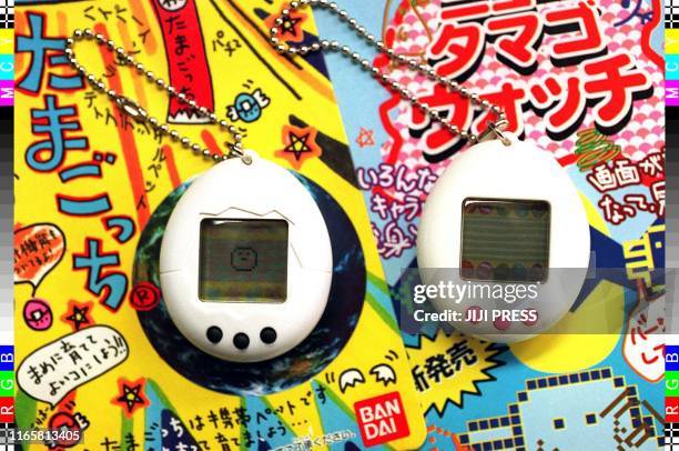 Picture shows Bandai's electronic virtual pet "Tamagotchi" and a fake "Tamago Watch" which was seized by police in Osaka 29 May. Police raided a...