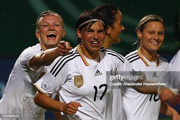 Alexandra Popp of Germany celebrates scoring the 3rd team goal with her team mates Ariane Hingst (2nd L and Martina Mueller during the women's...