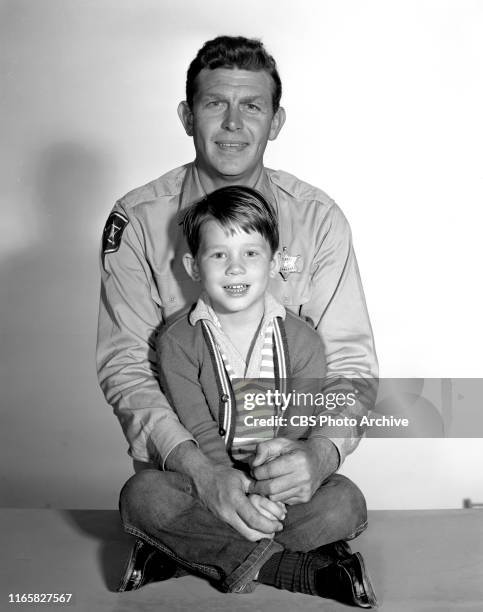 Cast members of the CBS television rural comedy program, The Andy Griffith Show. Pictured from top is Andy Griffith , Ron Howard .