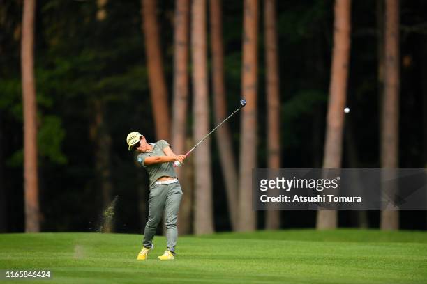 Chie Arimura of Japan hits her second shot on the 14th hole during the third round of the Daito Kentaku eHeya Net Ladies at Narusawa Golf Club on...