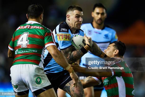 Joshua Dugan of the Sharks runs the ball during the round 20 NRL match between the Cronulla Sharks and the South Sydney Rabbitohs at Shark Park on...