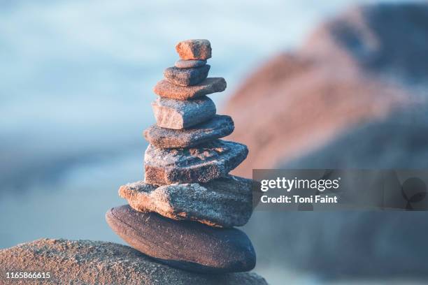 a hobby of rock stacking - stone concept stockfoto's en -beelden