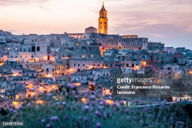 matera, townscape at sunset from belvedere della murgia. basilicata, italy - puglia italy stock pictures, royalty-free photos & images
